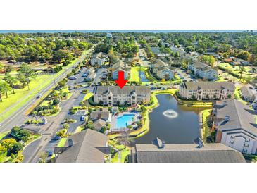 Aerial view of condo community with pool and pond at 3761 Citation Way # 521 & S-54, Myrtle Beach, SC 29577