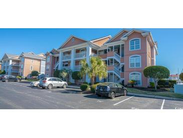 Attractive condo building with ample parking and landscaping at 4625 Lightkeepers Way # L, Little River, SC 29566