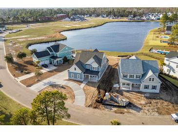 Aerial view of new homes under construction, showcasing waterfront community at 477 Starlit Way, Myrtle Beach, SC 29579