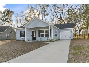 Newly built home with light blue siding, gray driveway and landscaping at 508 Truitt Dr., Longs, SC 29568