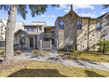 Attractive exterior of a two-story townhome with landscaping and walkway at 611 S 13Th Ave. # 175, Surfside Beach, SC 29575