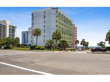 Oceanfront building with parking and palm trees at 7000 N Ocean Blvd. # 326, Myrtle Beach, SC 29572