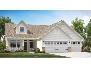 White two-story house with a double-car garage and landscaped lawn at 711 Isle Verde Dr, Myrtle Beach, SC 29579