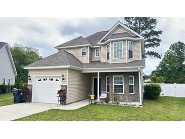 Two-story house with brick and siding exterior, a large yard, and a two-car garage at 788 Rambler Ct., Myrtle Beach, SC 29588