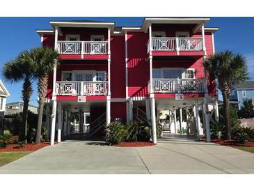 Red two-story house with parking and palm trees at 118 Seabreeze Dr., Murrells Inlet, SC 29576