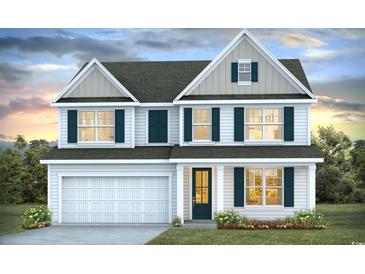 Two-story home with gray and white siding, dark green shutters, and a two-car garage at 398 Wingspan Ct., Myrtle Beach, SC 29588