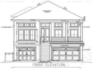 Front elevation of a home with architectural shingles and a finished grade of 17.00' at 429 Harbour View Dr., Myrtle Beach, SC 29579