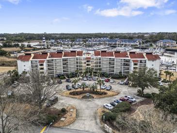 Expansive resort featuring waterfront condos, boat docks, and ample parking with beautiful views of the waterway and the ocean at 4390 Bimini Ct. # 206-C, Little River, SC 29566