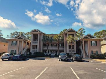 Attractive condo building with ample parking and landscaping at 478 Pinehurst Ln. # 17F, Pawleys Island, SC 29585