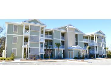 Two-story building with light green siding, white trim, and balconies at 81 Delray Dr. # 2-C, Murrells Inlet, SC 29576