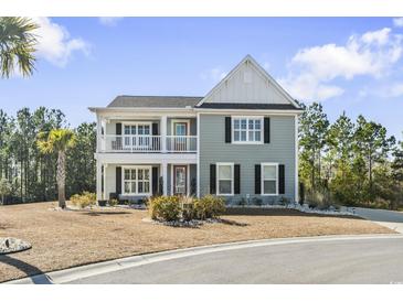 Two-story house with gray siding, white accents, and a balcony at 208 Switch Grass Ct., Myrtle Beach, SC 29579