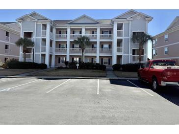 Three-story building exterior with parking lot and landscaping at 636 Waterway Village Blvd. # 17C, Myrtle Beach, SC 29579