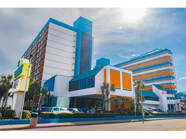 Striking exterior shot of a colorful multi-story hotel, showcasing its unique architectural design at 1501 S Ocean Blvd. S # 1450, Myrtle Beach, SC 29577