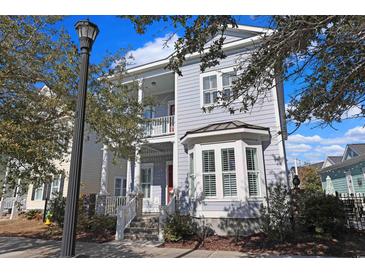 Gray two-story house with white shutters and a front porch at 822 Farrow Pkwy., Myrtle Beach, SC 29577