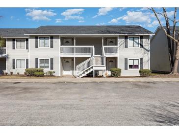 Two-story building with multiple units, balconies, and ample parking at 3555 Highway 544 # 2C, Conway, SC 29526