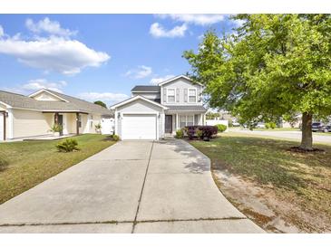 Charming two-story home with long driveway, attached garage and well-manicured front lawn at 395 Thistle Ln., Myrtle Beach, SC 29579