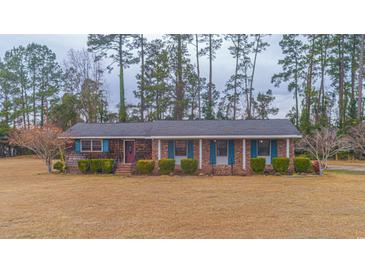 Brick ranch house with a large yard and mature trees at 1901 Harris Short Cut Rd., Conway, SC 29526