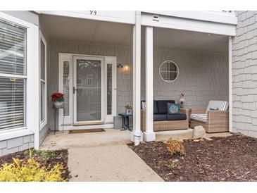Inviting front porch with seating area and charming details at 4396 Baldwin Ave. # 94, Little River, SC 29566
