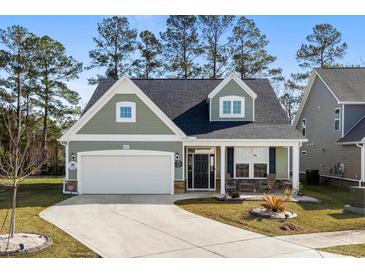 Charming one-story home featuring a two-car garage and a welcoming front porch at 2449 Campton Loop, Conway, SC 29527