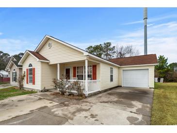 Charming single-story home featuring a cozy front porch and attached one-car garage at 1236 Pollen Loop, Murrells Inlet, SC 29576