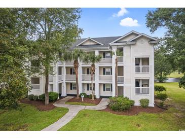 Inviting exterior view of a multi-story condo building with balconies and lush landscaping at 537 White River Dr. # 17D, Myrtle Beach, SC 29578