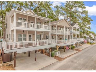 Charming beach homes featuring multiple covered decks, offering beautiful outdoor living spaces and curb appeal at 6001-1383 S Kings Hwy., Myrtle Beach, SC 29575