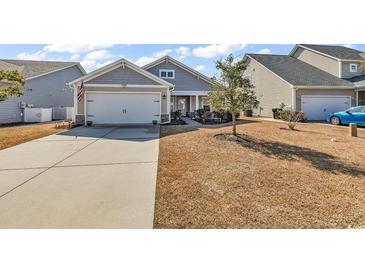 Charming single-Gathering home with a two-car garage and well-maintained landscaping at 1166 Bethpage Dr., Myrtle Beach, SC 29579