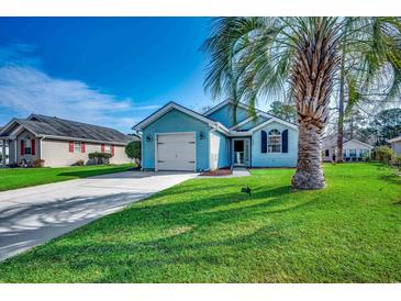 Charming blue single-story home featuring a well-maintained front yard with a classic white garage door at 1205 Formby Ct., Myrtle Beach, SC 29588