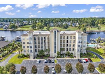 A beautiful multi-story condo building with a waterway and golf course nearby at 249 Venice Way # 3301, Myrtle Beach, SC 29577