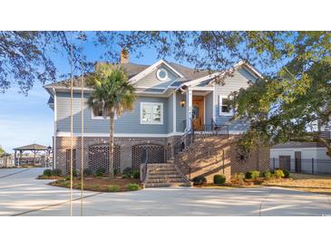 Stunning two-story home with a beautiful brick foundation and a well-manicured front yard at 3567 Marion Ln., Murrells Inlet, SC 29576