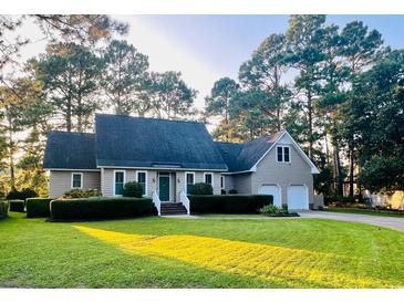 Charming single-Gathering home boasting a manicured lawn and lush landscaping, complete with an attached two-car garage at 8234 Timber Ridge Rd., Conway, SC 29526