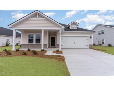 Charming single Gathering home featuring a two-car garage and a well-maintained front yard at 8713 High Banks Way, Longs, SC 29568