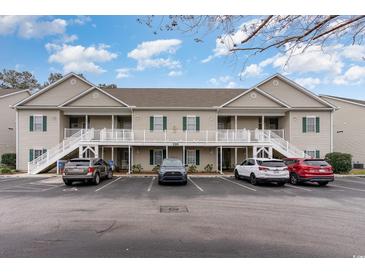 Inviting two-story condo building with ample parking and accessible ramp at 130 Lazy Willow Ln. # 204, Myrtle Beach, SC 29588