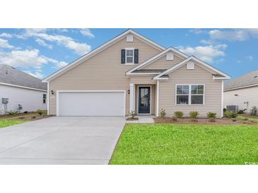 Charming single-Gathering home with a well-manicured lawn and a two-car garage at 415 Clear Lake Dr., Conway, SC 29526