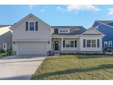 Charming single-Gathering home with a well-manicured lawn and an attached two-car garage at 621 Woodside Dr., Conway, SC 29526