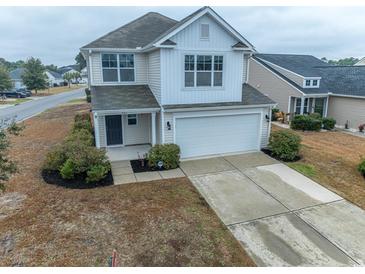 Charming two-story home with landscaped yard, attached garage and covered front porch at 901 Tullamore Ct., Myrtle Beach, SC 29579