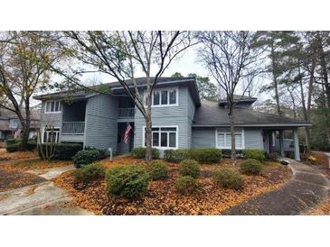 Charming two-story home with front yard landscaping and a curved walkway at 1221 Tidewater Dr. # 2821, North Myrtle Beach, SC 29582