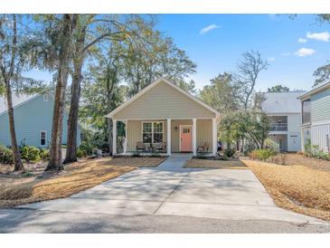 Charming single Gathering home featuring a welcoming front porch and large driveway at 170 Minnow Dr., Pawleys Island, SC 29585