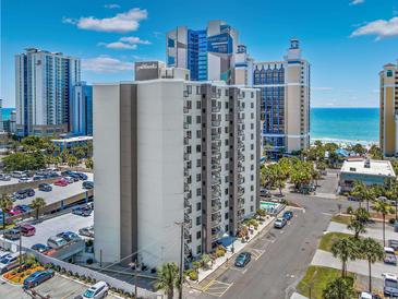 Aerial view of condo building near the beach and parking lots on a beautiful sunny day at 400 20Th Ave. N # 101, Myrtle Beach, SC 29577