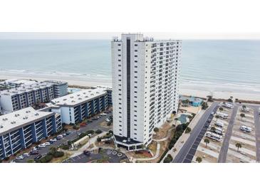 Stunning aerial view of a beachfront condo with multiple pools and ample parking near the ocean at 5905 South Kings Hwy. # 706, Myrtle Beach, SC 29575