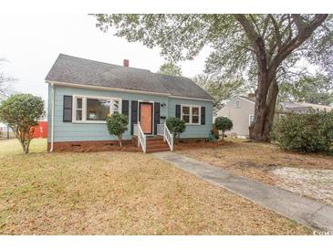 Charming one-story home with light blue siding, front yard, and welcoming entryway at 1105 Palmetto St., Georgetown, SC 29440