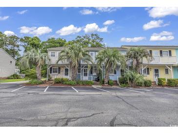 Charming condos with balconies and palm trees provide a relaxing vacation retreat in a great location at 3866 Highway 17 Business # C- 9, Murrells Inlet, SC 29576