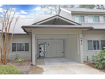 Inviting exterior of home featuring a covered carport and neutral siding at 48 Twelve Oaks Dr. # 2, Pawleys Island, SC 29585