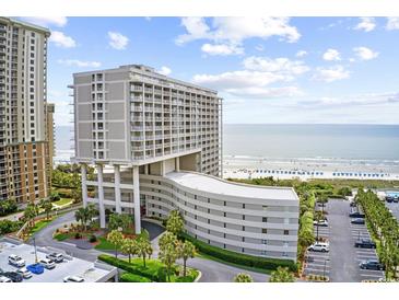 Stunning oceanfront condo building featuring a unique architectural design and beautiful landscaping at 9840 Queensway Blvd. # 1207, Myrtle Beach, SC 29572