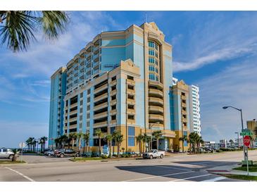 Beautiful beachfront resort with parking garage, palm trees, and blue skies at 2501 S Ocean Blvd. # 601, Myrtle Beach, SC 29577