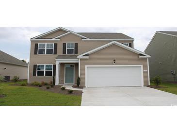 Inviting two-story home features a landscaped yard and a neutral color scheme at 352 Rookroost Circle, Conway, SC 29526