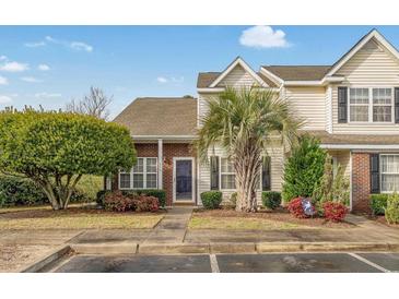 Charming two-story townhome with a well-manicured lawn, lovely landscaping, and a brick facade in a desirable neighborhood at 3567 Chestnut Dr. # 3567, Myrtle Beach, SC 29577