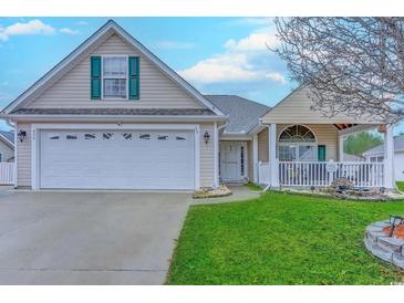 Charming single-story home with an attached two-car garage and a well-manicured front yard at 920 Leather Leaf Ln., Longs, SC 29568