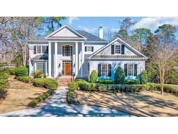 Stately home featuring a columned front facade and landscaped grounds at 3369 Collins Creek Dr., Murrells Inlet, SC 29576