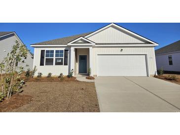 Charming single-story home with a clean white facade, attached garage and newly landscaped yard at 365 Rookroost Circle, Conway, SC 29526